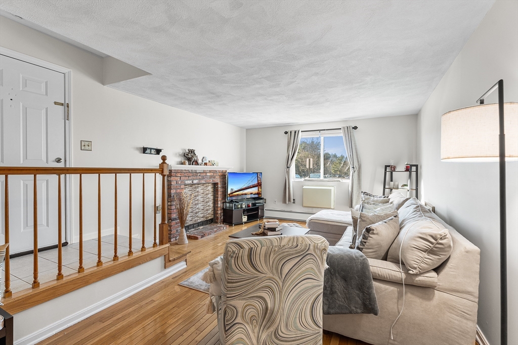 6 Erick Road, Unit 75 Mansfield, MA 02048 - Photo 2 of 20 a bed room with furniture and a window