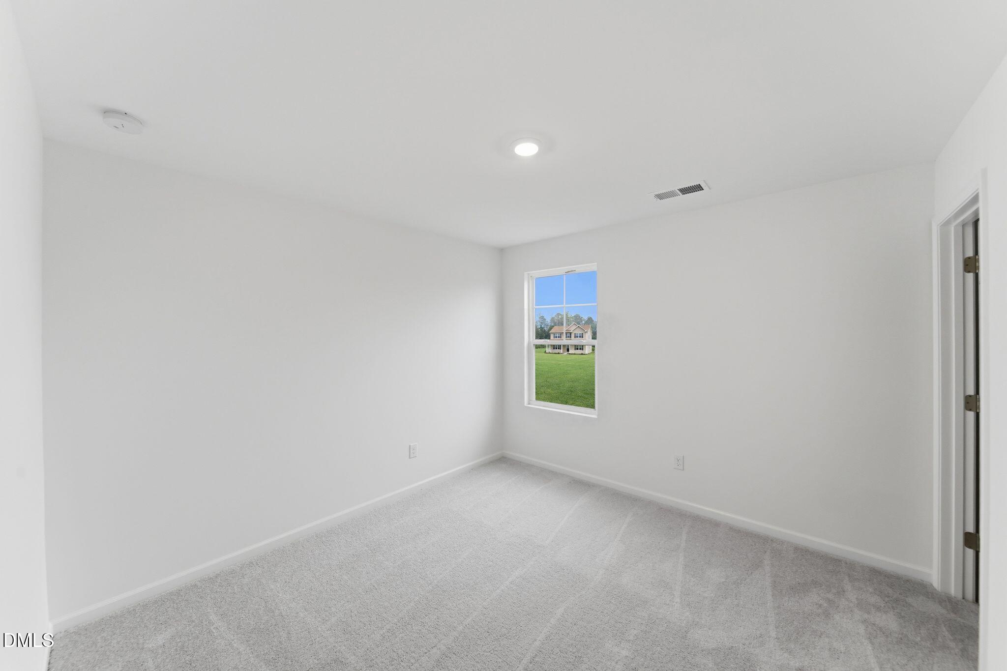 5842 Millstone Way Sims, NC 27880 - Photo 17 of 22 a view of an empty room with a window