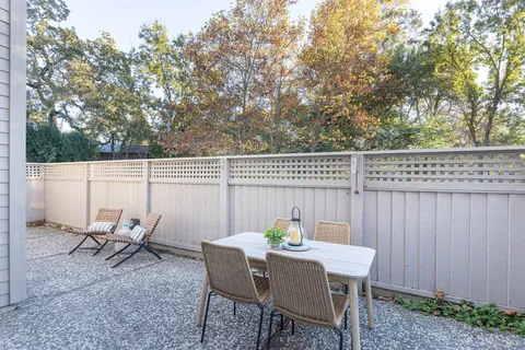 a view of a chairs and table in patio