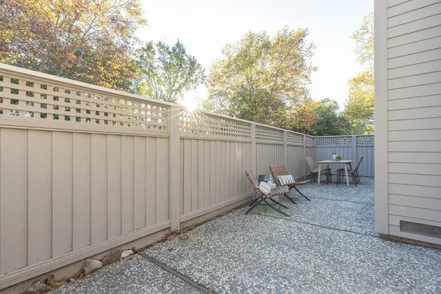 a balcony view with a seating space