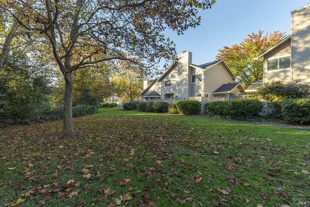 a view of a big yard next to a house