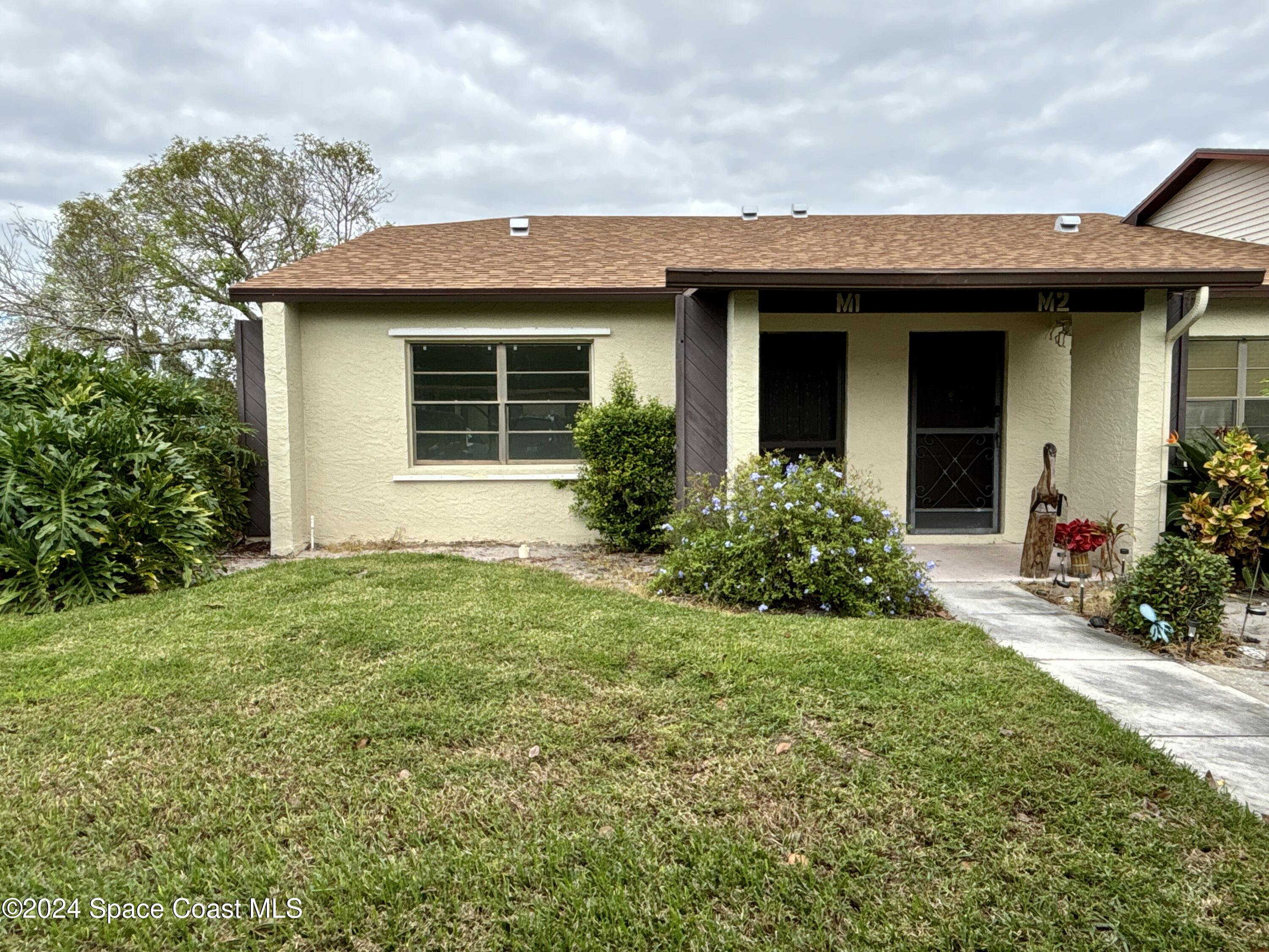 6028 Indrio Road, Unit M1 Fort Pierce, FL 34951 - Photo 1 of 32 Front of home
