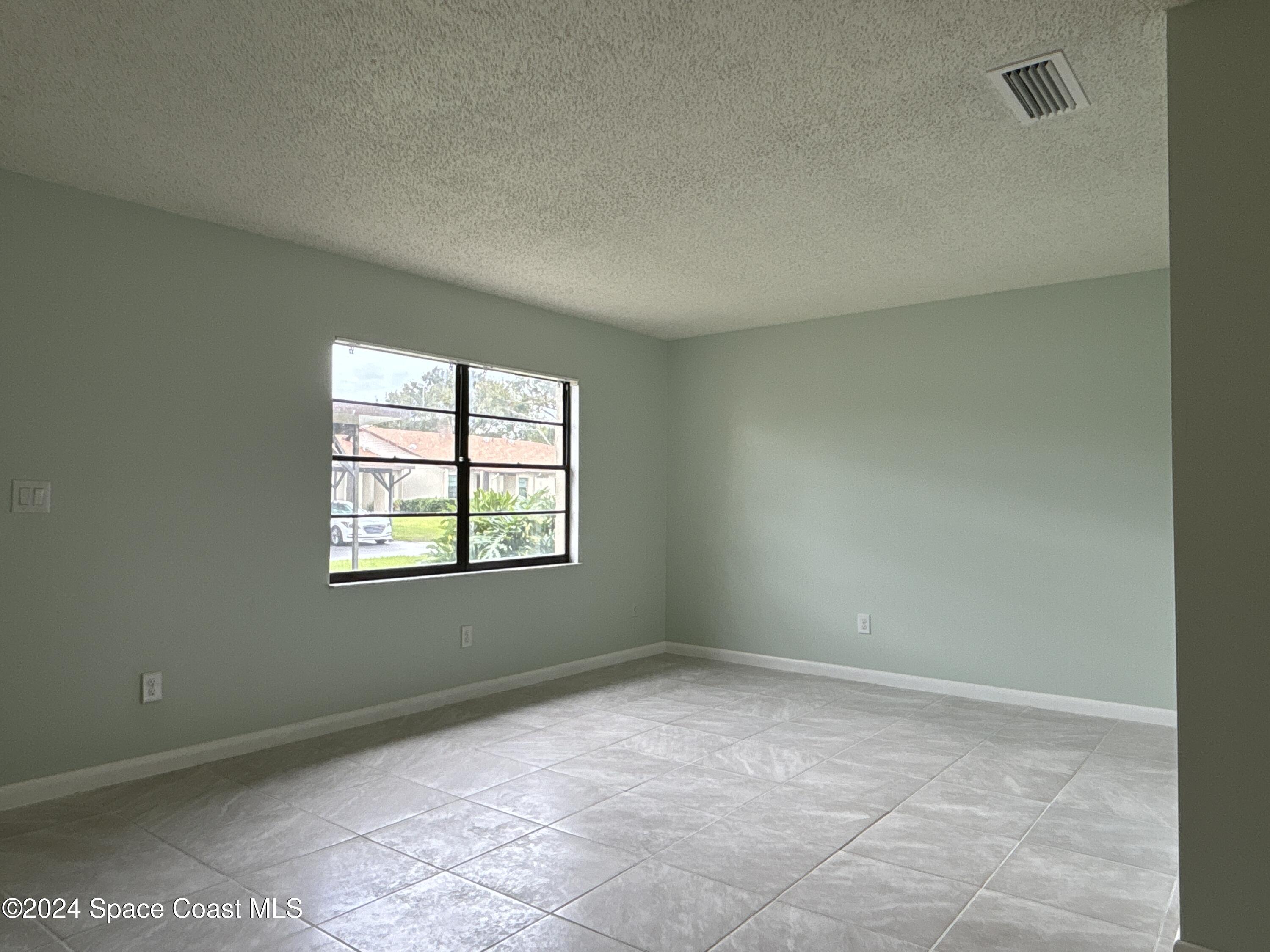 6028 Indrio Road, Unit M1 Fort Pierce, FL 34951 - Photo 5 of 32 DJI_20241119_115852_583