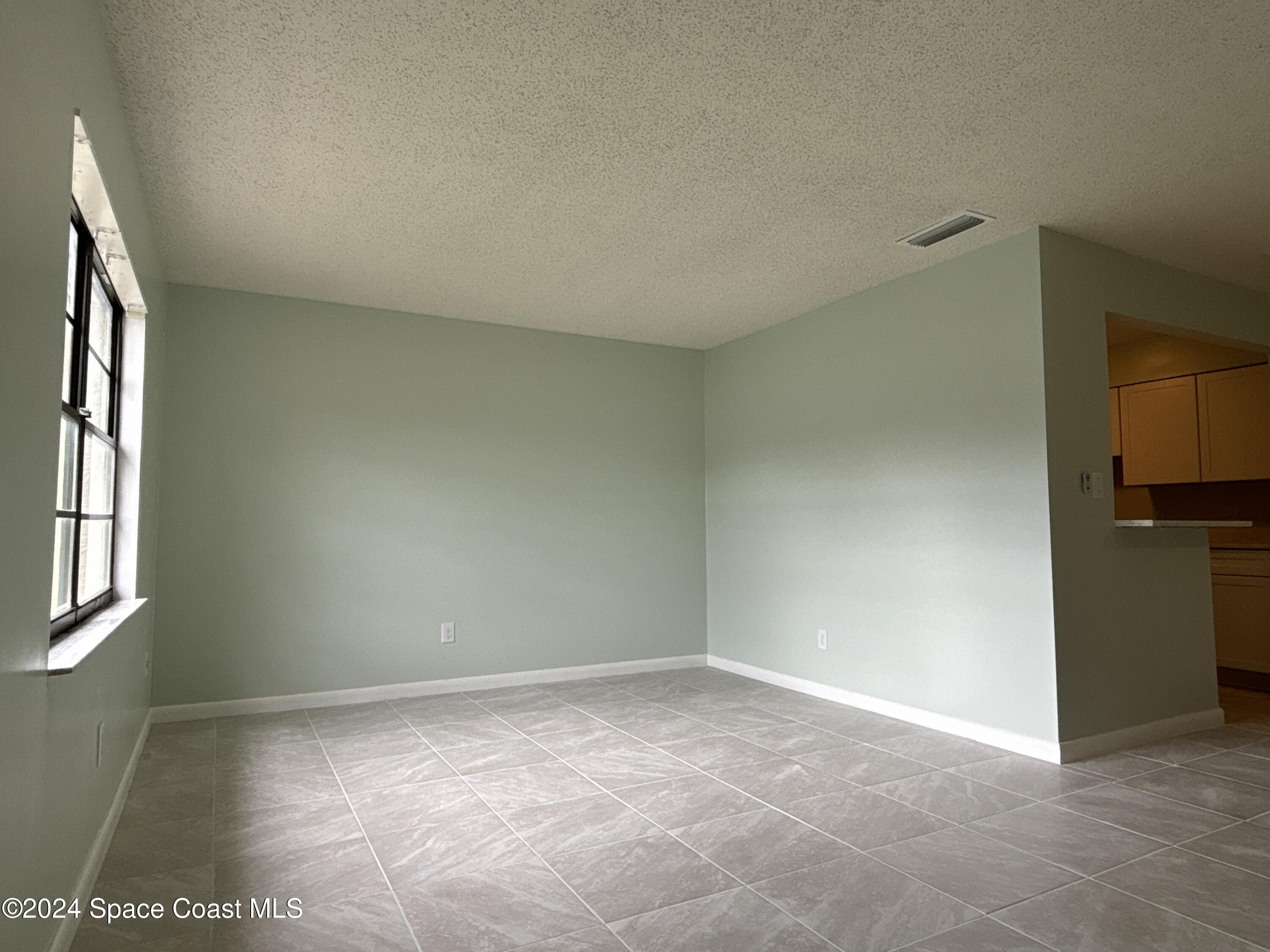 6028 Indrio Road, Unit M1 Fort Pierce, FL 34951 - Photo 7 of 32 DJI_20241119_114341_891