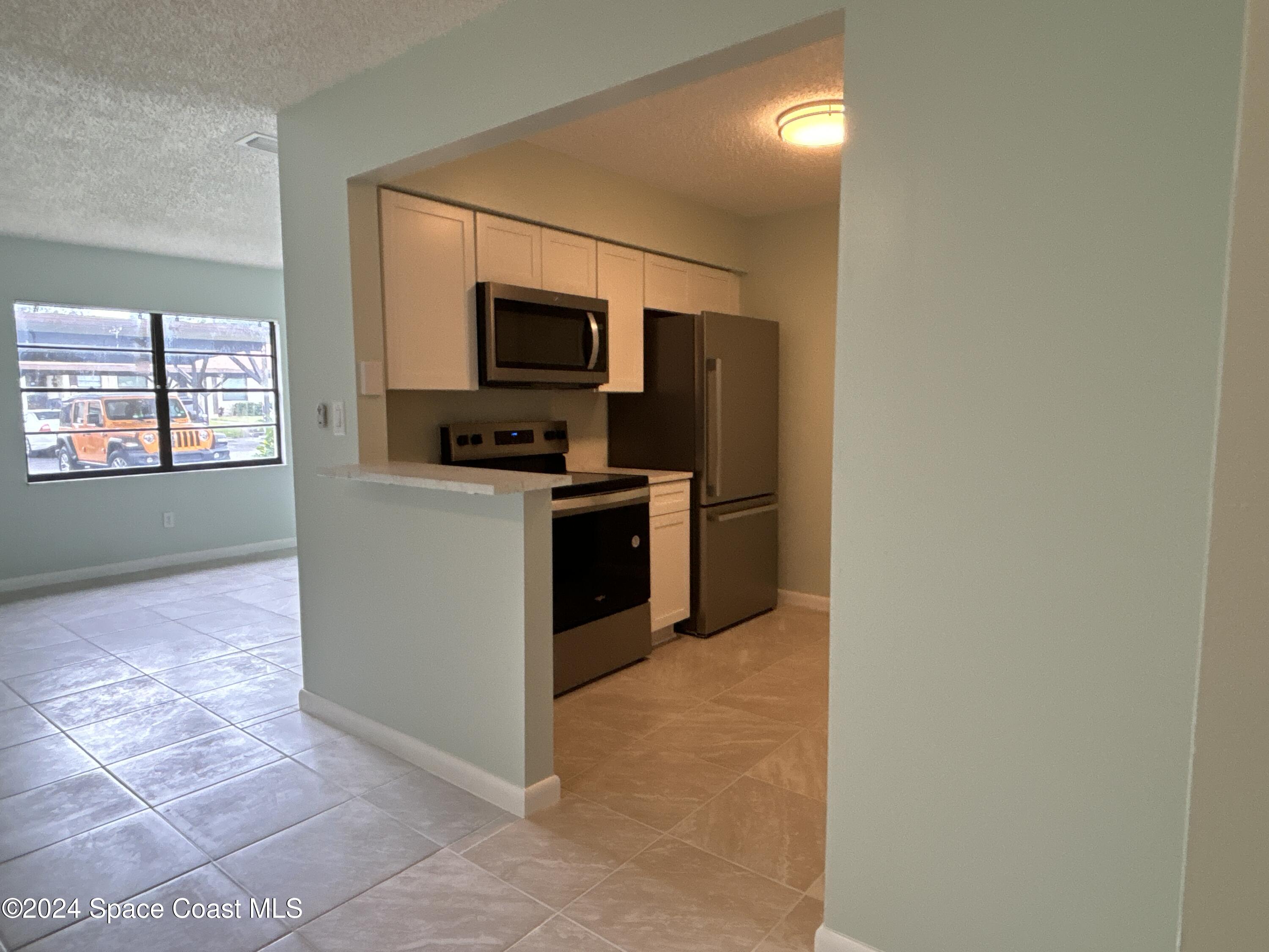 6028 Indrio Road, Unit M1 Fort Pierce, FL 34951 - Photo 9 of 32 DJI_20241119_114324_320
