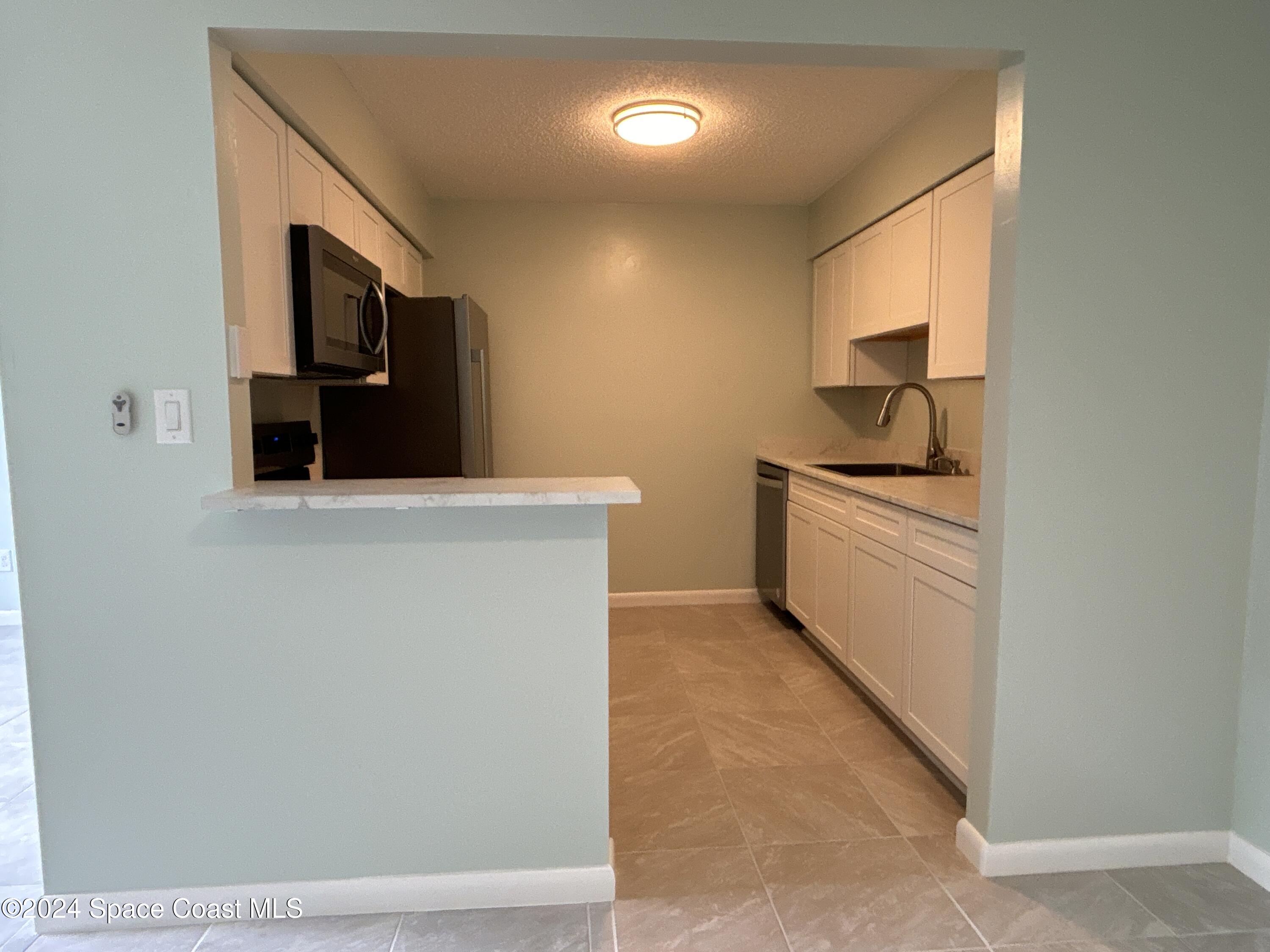 6028 Indrio Road, Unit M1 Fort Pierce, FL 34951 - Photo 10 of 32 DJI_20241119_114310_891