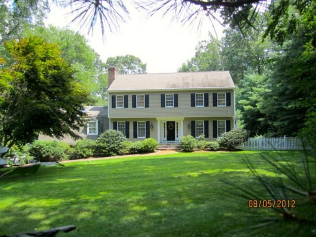 3 Ledgewood Road Redding, CT 06896 - Photo 1 of 1 a front view of a house with a yard table and chairs