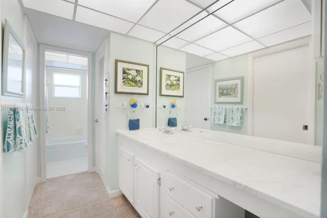a spacious bathroom with a shower and a sink