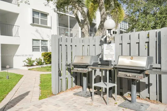 a table and chairs in front of a house