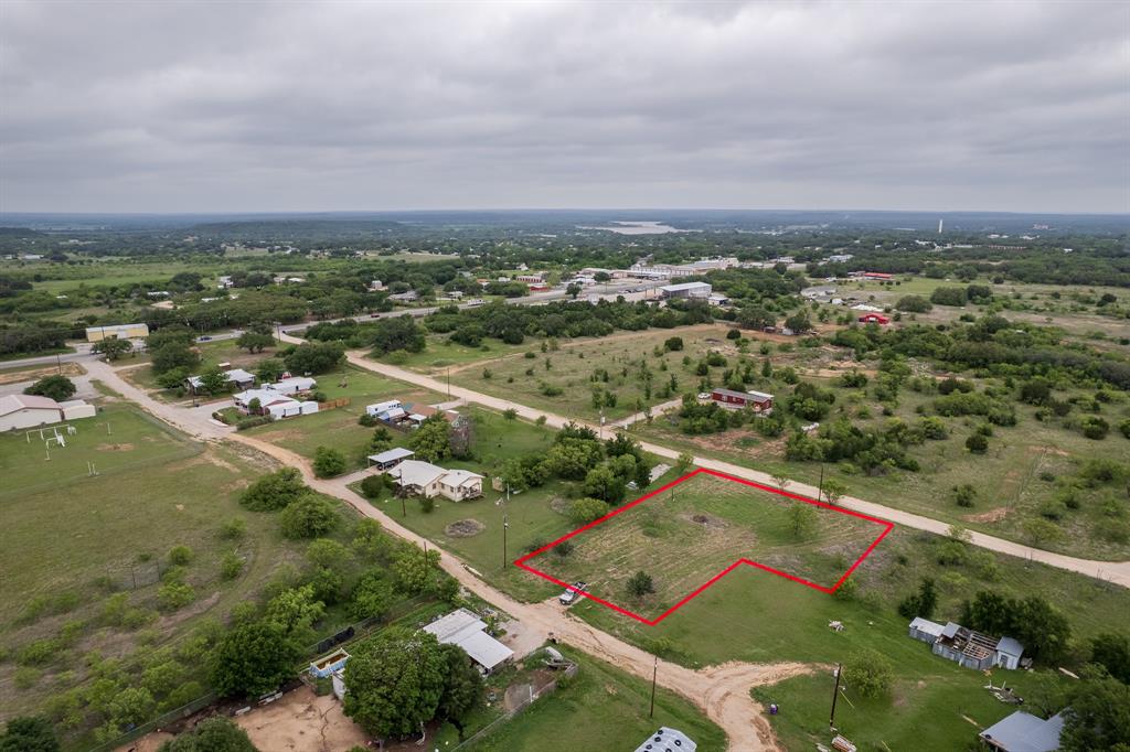6723 Hidden Valley Road Brownwood, TX 76801 - Photo 6 of 6 an aerial view of residential houses with outdoor space and trees