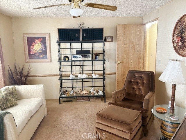 14851 Jeffrey Road, Unit 331 Irvine, CA 92618 - Photo 5 of 12 a living room with furniture a ceiling fan and a window