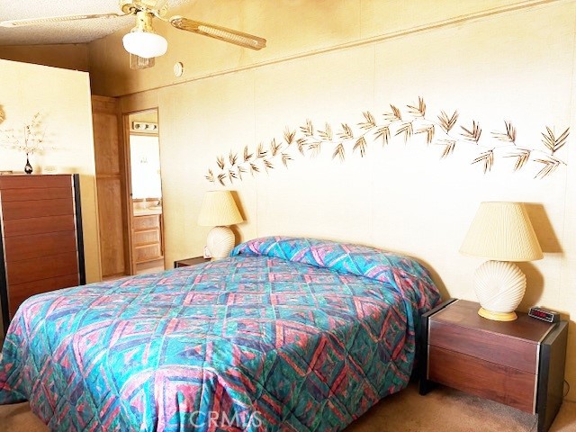 14851 Jeffrey Road, Unit 331 Irvine, CA 92618 - Photo 7 of 12 a bedroom with a bed and a chandelier