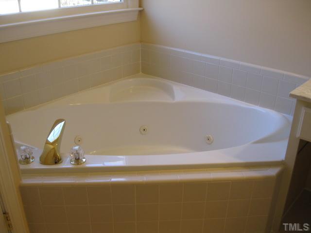 1404 G W Court Raleigh, NC 27603 - Photo 15 of 25 a bathroom with a tub