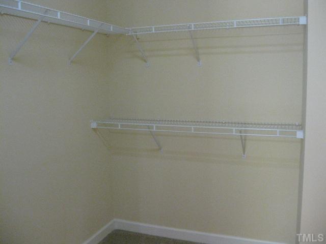 1404 G W Court Raleigh, NC 27603 - Photo 18 of 25 a view of a room with racks on the wall