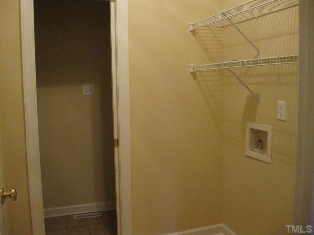1404 G W Court Raleigh, NC 27603 - Photo 22 of 25 a bathroom with a shower