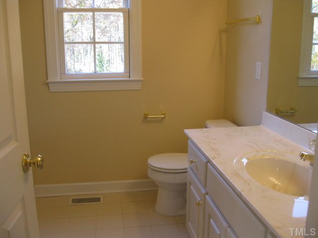 1404 G W Court Raleigh, NC 27603 - Photo 23 of 25 a bathroom with a sink and toilet