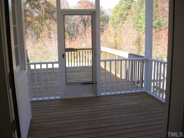 1404 G W Court Raleigh, NC 27603 - Photo 24 of 25 a view of porch with wooden floor