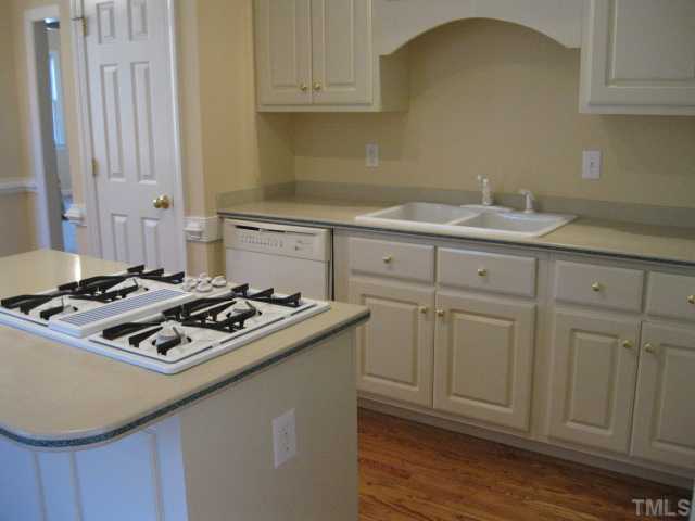1404 G W Court Raleigh, NC 27603 - Photo 10 of 25 a white stove top oven sitting inside of a kitchen