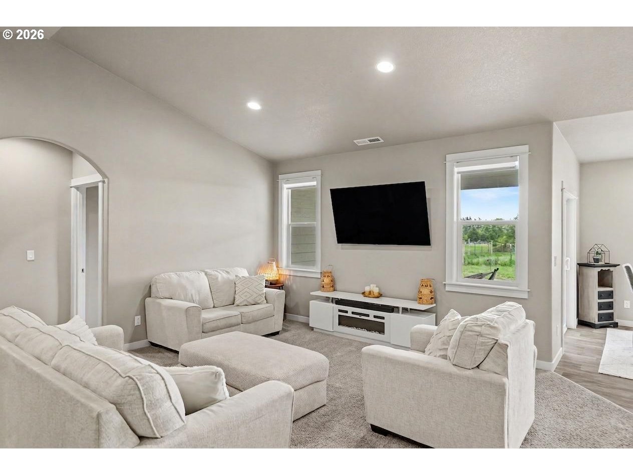 11862 Steinkamp Road Southeast Aumsville, OR 97325 - Photo 16 of 48 a living room with furniture and a flat screen tv