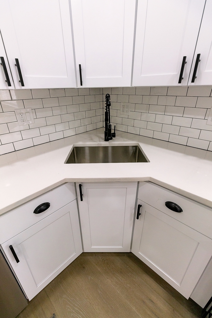 3755 West Addison Street, Unit 2E Chicago, IL 60618 - Photo 3 of 20 a kitchen with a sink a stove and cabinets