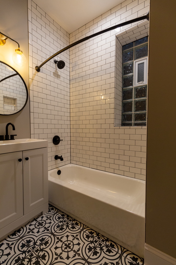 3755 West Addison Street, Unit 2E Chicago, IL 60618 - Photo 10 of 20 a bathroom with a bathtub and a shower