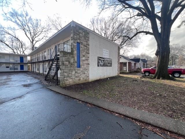600 Patterson Street Memphis, TN 38111 - Photo 6 of 10 a view of a house with a yard covered with snow