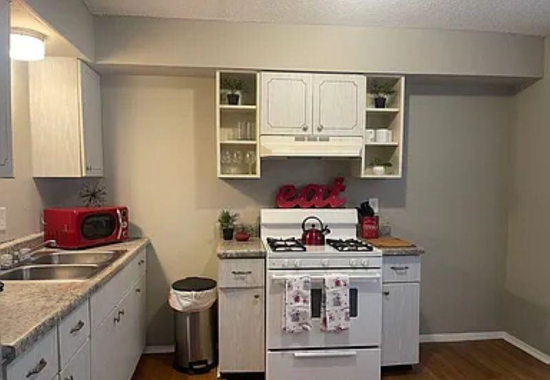 600 Patterson Street Memphis, TN 38111 - Photo 9 of 10 a kitchen with stainless steel appliances granite countertop a stove and cabinets