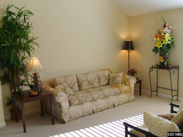 724 Silver Mine Court Reno, NV 89521 - Photo 2 of 9 a living room with furniture and a potted plant