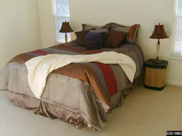 724 Silver Mine Court Reno, NV 89521 - Photo 9 of 9 a bedroom with a bed and window