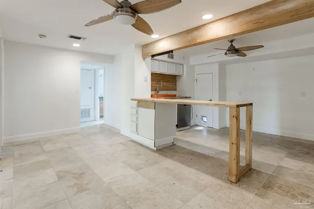 a view of a living room with windows