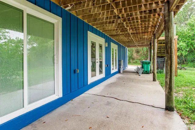 a view of balcony with wooden floor