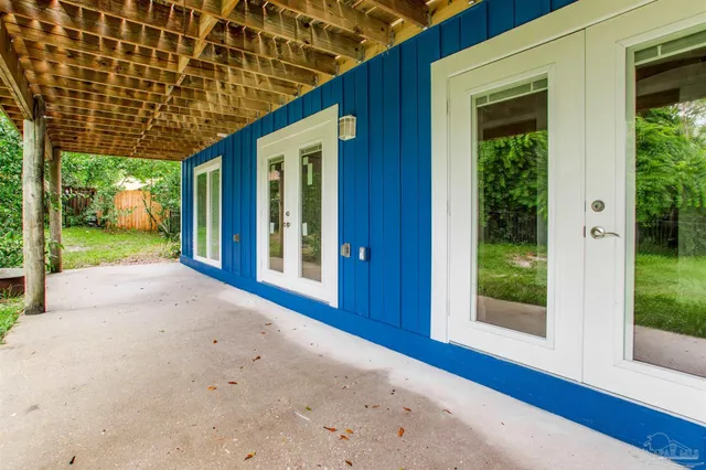 a view of balcony with wooden floor and fence