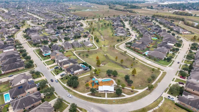 an aerial view of a house with swimming pool
