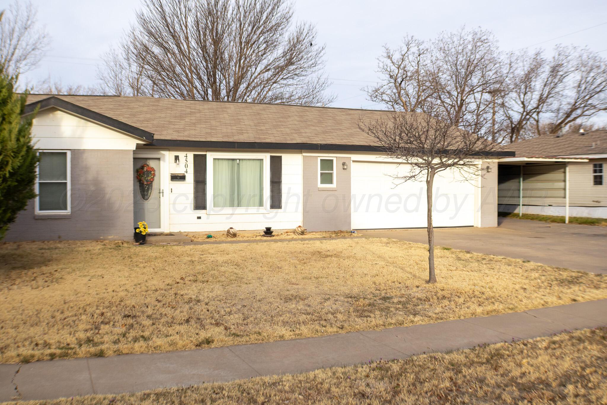 a front view of house with yard