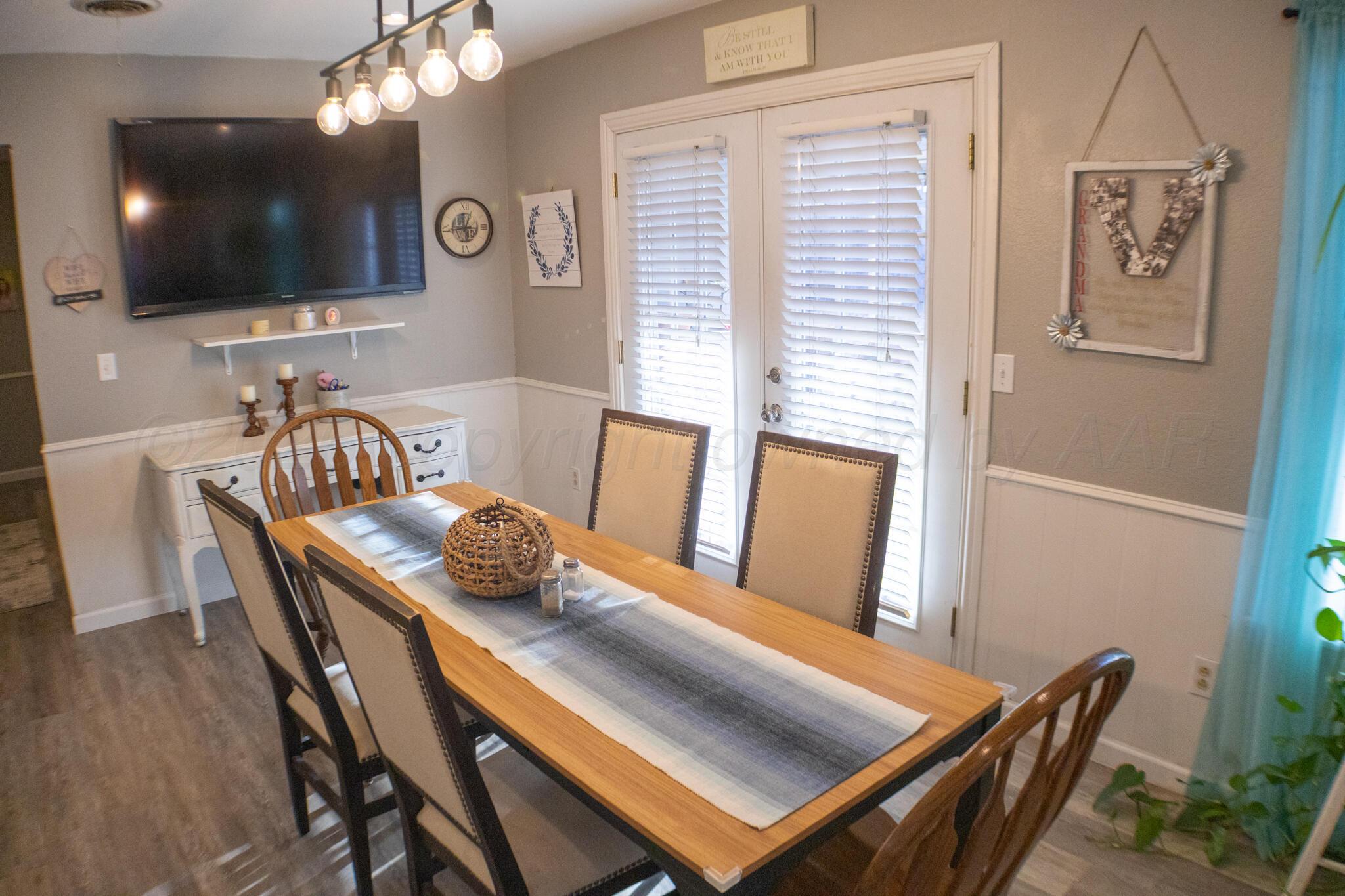 4504 Goodnight Trail Amarillo, TX 79109 - Photo 14 of 32 a view of a dining room with furniture and wooden floor