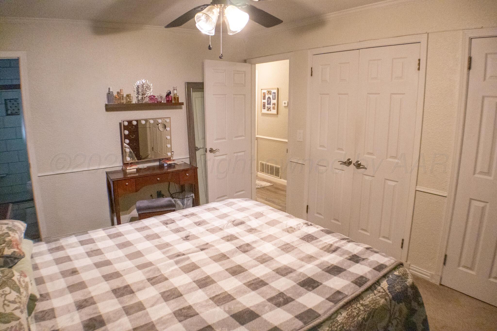 4504 Goodnight Trail Amarillo, TX 79109 - Photo 16 of 32 a bedroom with a bed and a dresser
