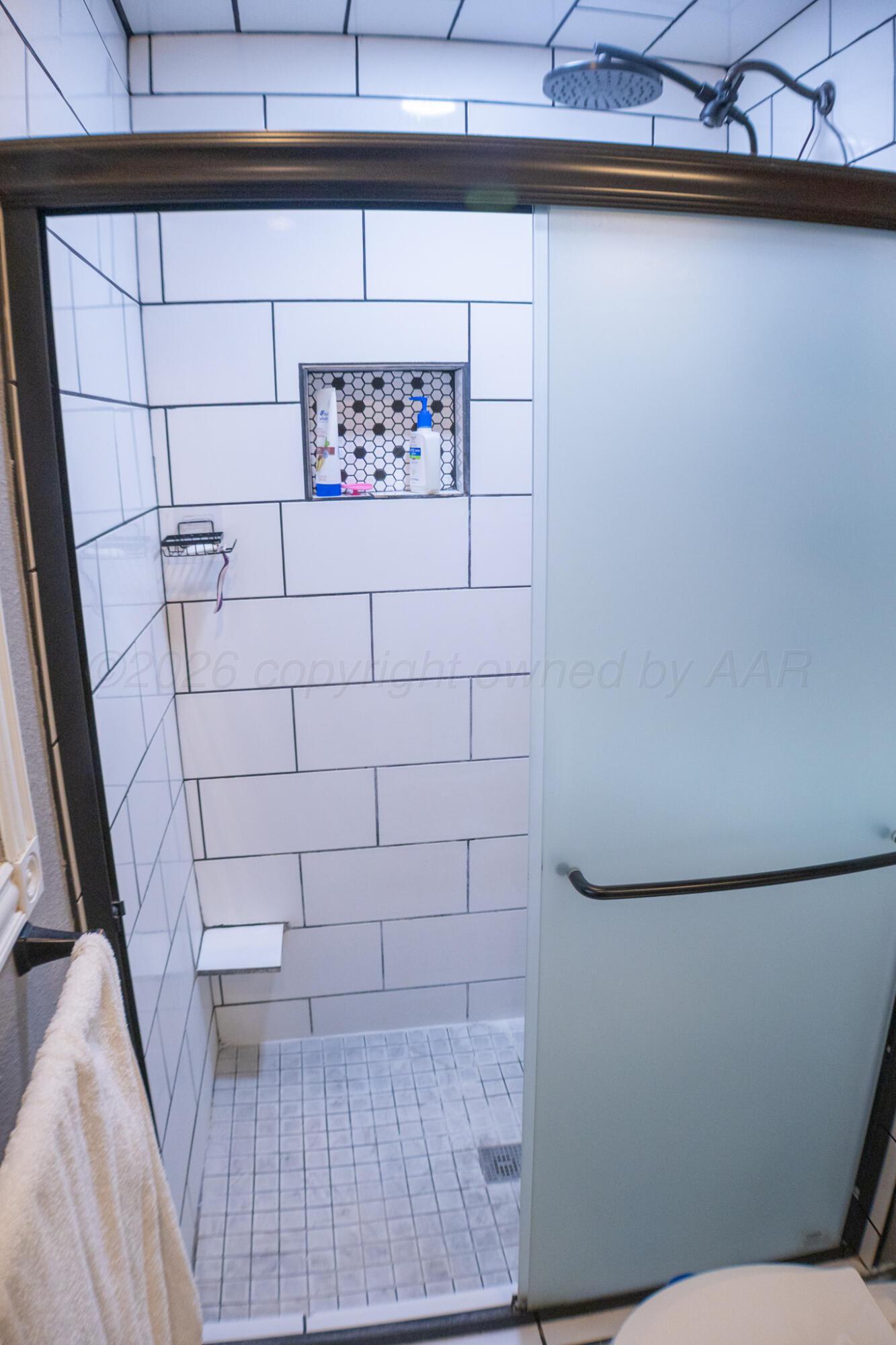4504 Goodnight Trail Amarillo, TX 79109 - Photo 19 of 32 a bathroom with a shower and a toilet