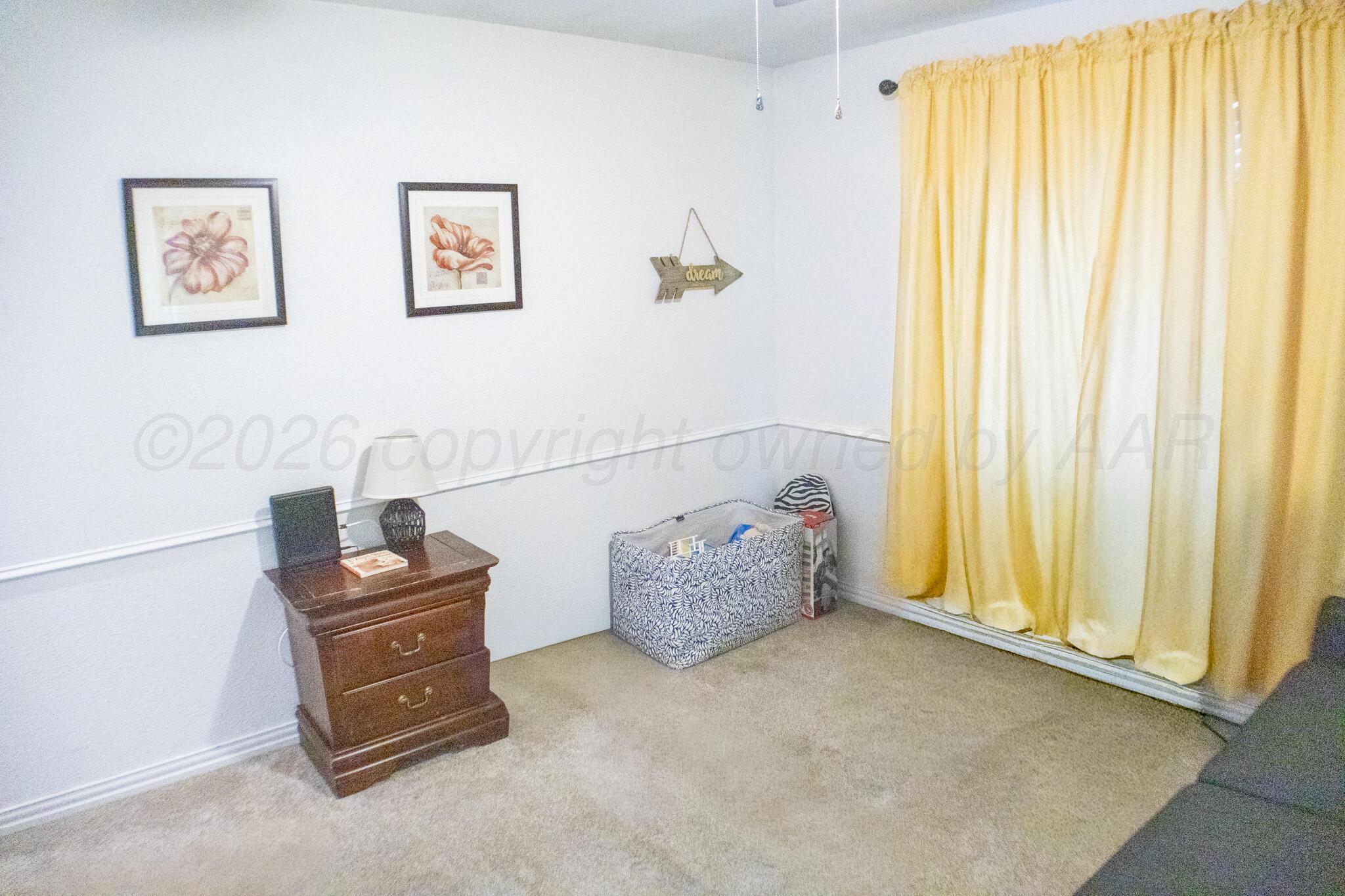 4504 Goodnight Trail Amarillo, TX 79109 - Photo 25 of 32 a living room with furniture and a window