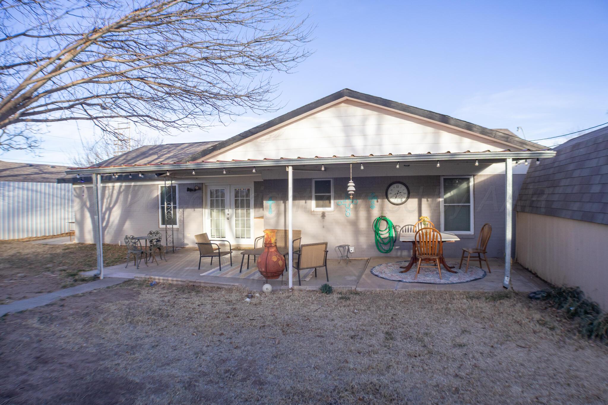 4504 Goodnight Trail Amarillo, TX 79109 - Photo 30 of 32 a view of a house with backyard porch and sitting area