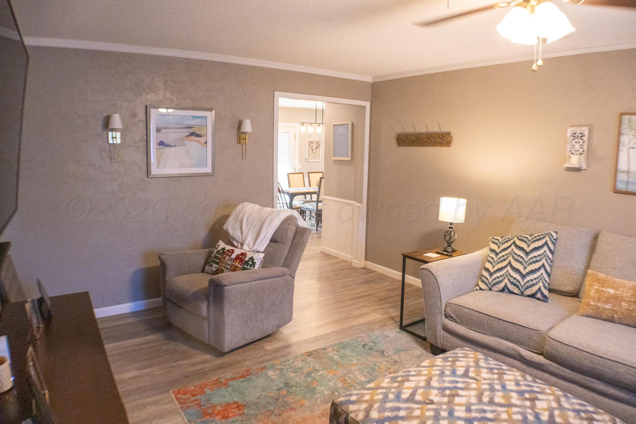 4504 Goodnight Trail Amarillo, TX 79109 - Photo 7 of 32 a living room with furniture and a couch