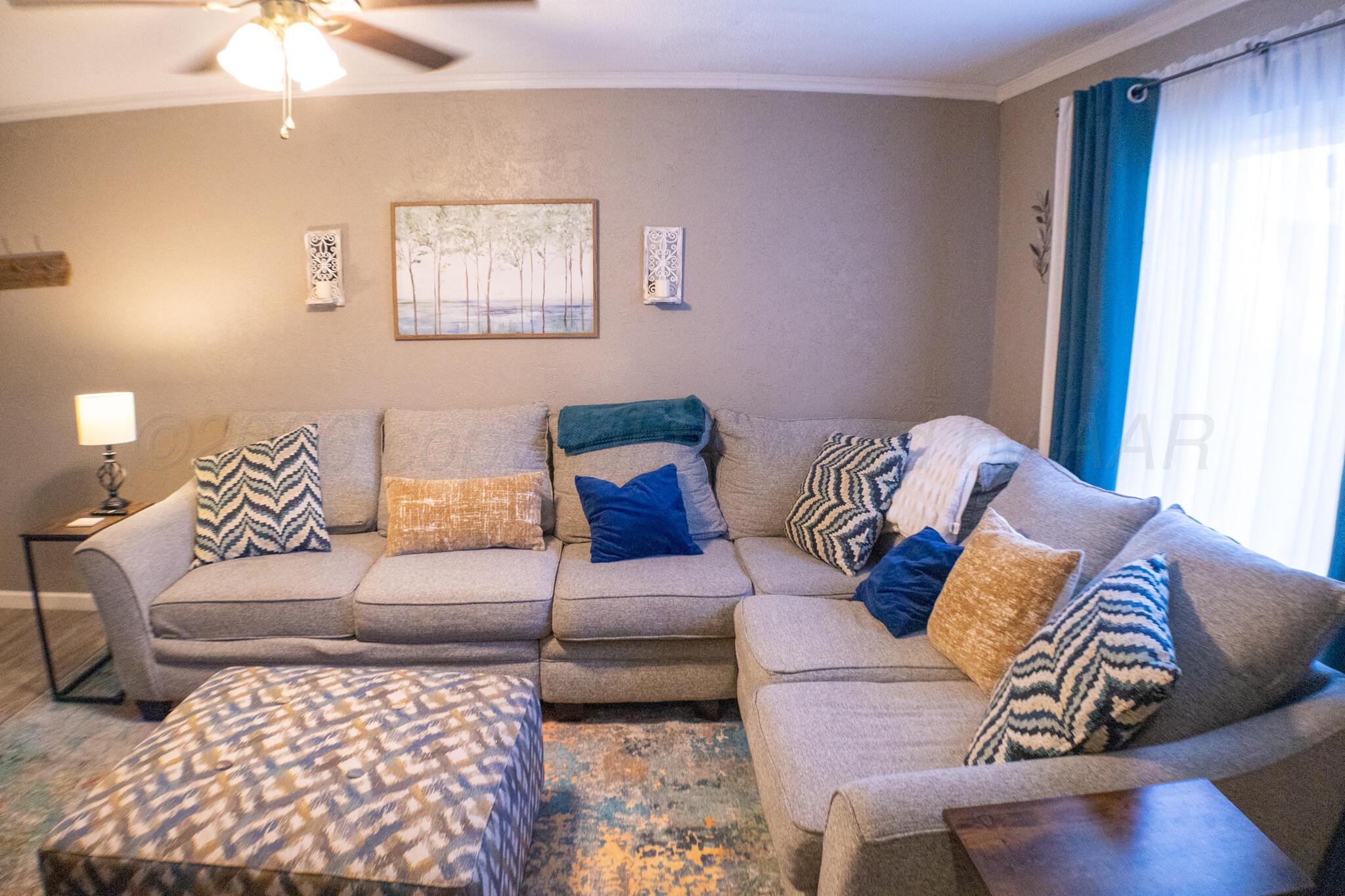 4504 Goodnight Trail Amarillo, TX 79109 - Photo 8 of 32 a living room with furniture and a couch