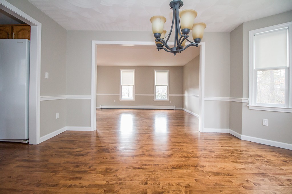 5 McGuire Road Sutton, MA 01590 - Photo 3 of 22 a view of a room with wooden floor closet and windows