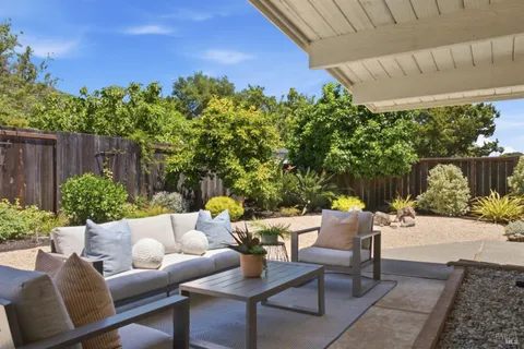 a outdoor living space with furniture and a potted plant