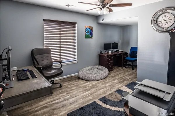 a bedroom with a bed and a chair