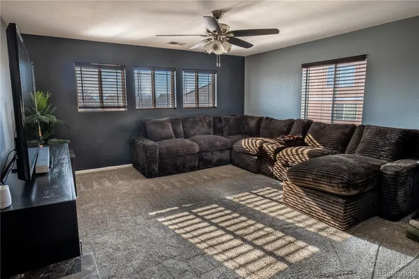 a living room with furniture and a window