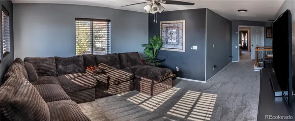 a living room with furniture and a window