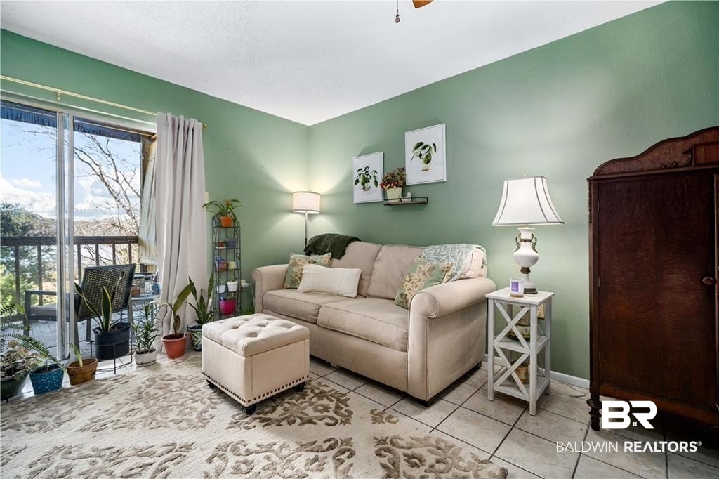 Living room featuring light tile patterned floors