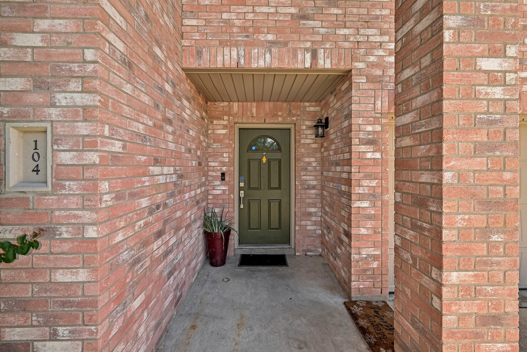 104 North Sumac Lane Georgetown, TX 78633 - Photo 6 of 40 A welcoming front entry features classic brick construction and an inviting covered porch.