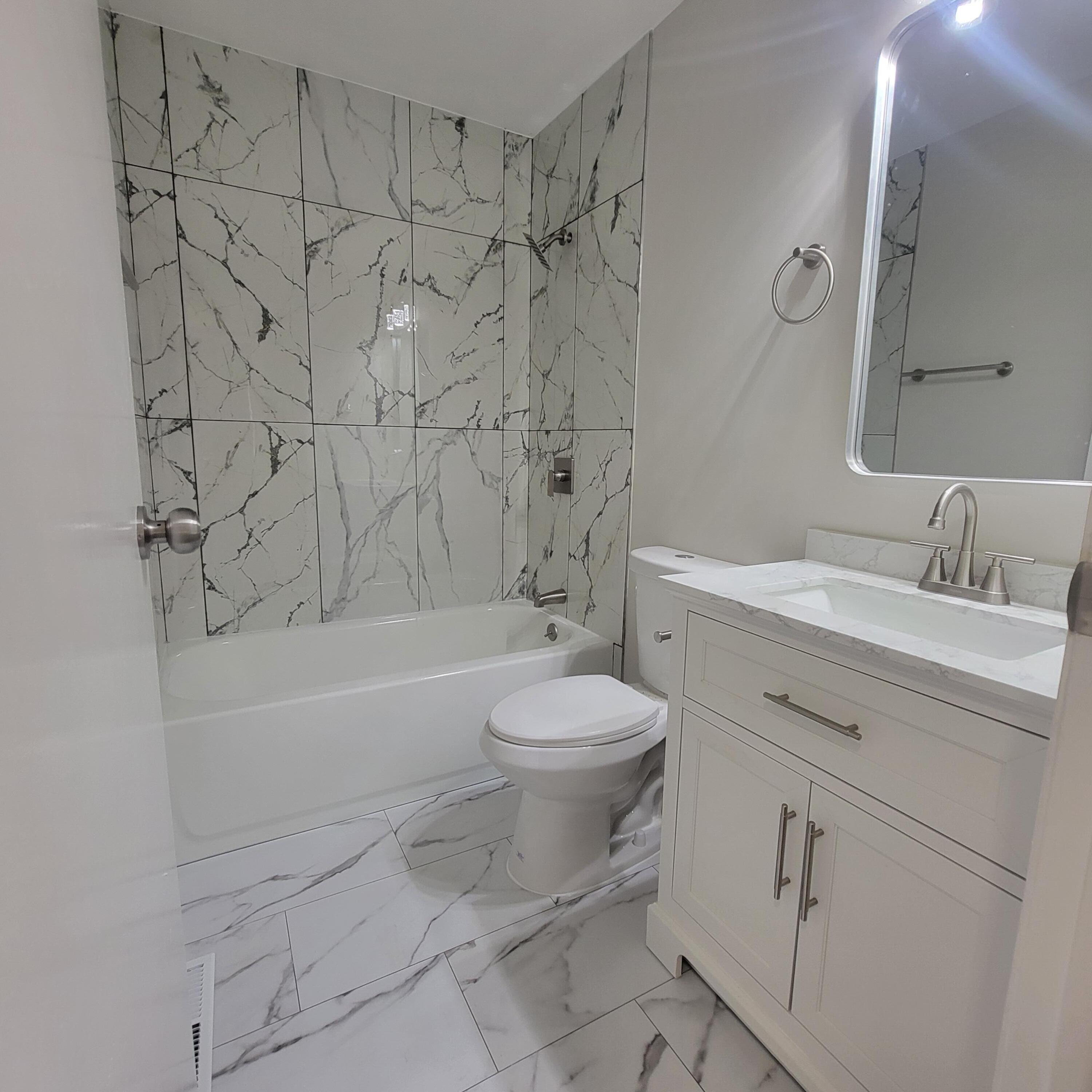 6676 Lakewood Avenue Portage, IN 46368 - Photo 7 of 14 a bathroom with a sink toilet and shower