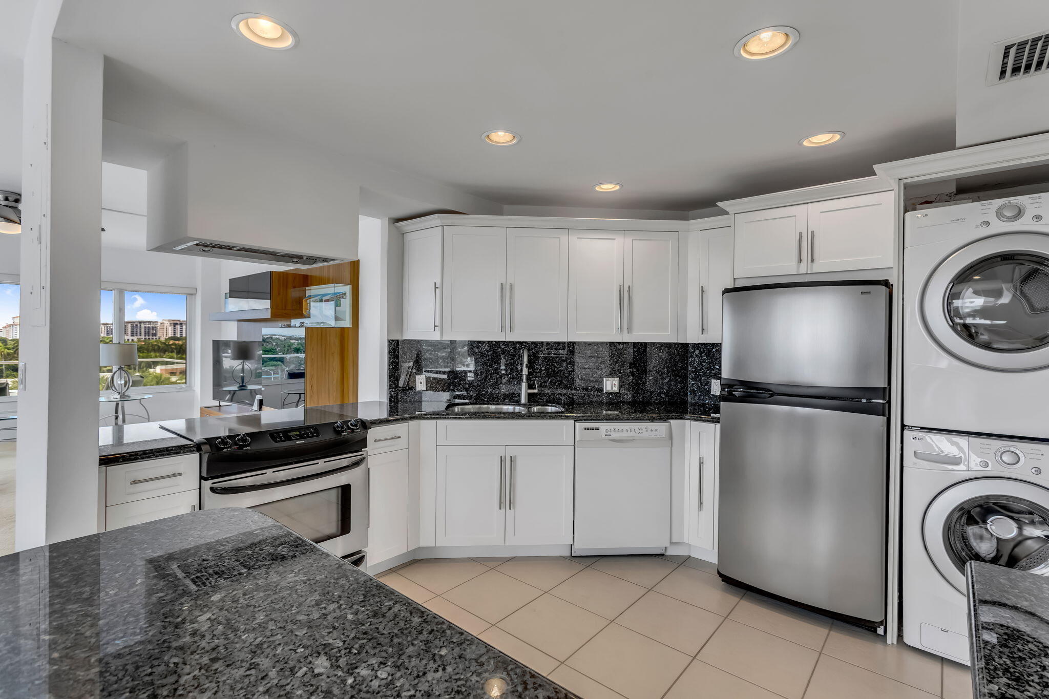 701 East Camino Real, Unit 8F Boca Raton, FL 33432 - Photo 31 of 54 a kitchen with a refrigerator sink and stove